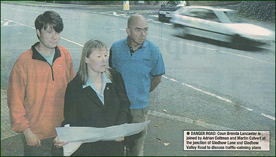 Councillor Brenda Lancaster is joined by Adrian Coltman and Martin Calvert at the junction of Gledhow Lane and Gledhow Valley Road to discuss traffic calming plans.