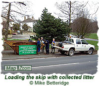 Loading the skip with collected litter